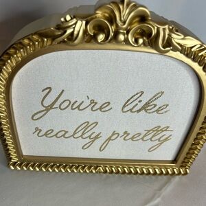 New (You’re Like Really Pretty” Gold and White Decorative Sign